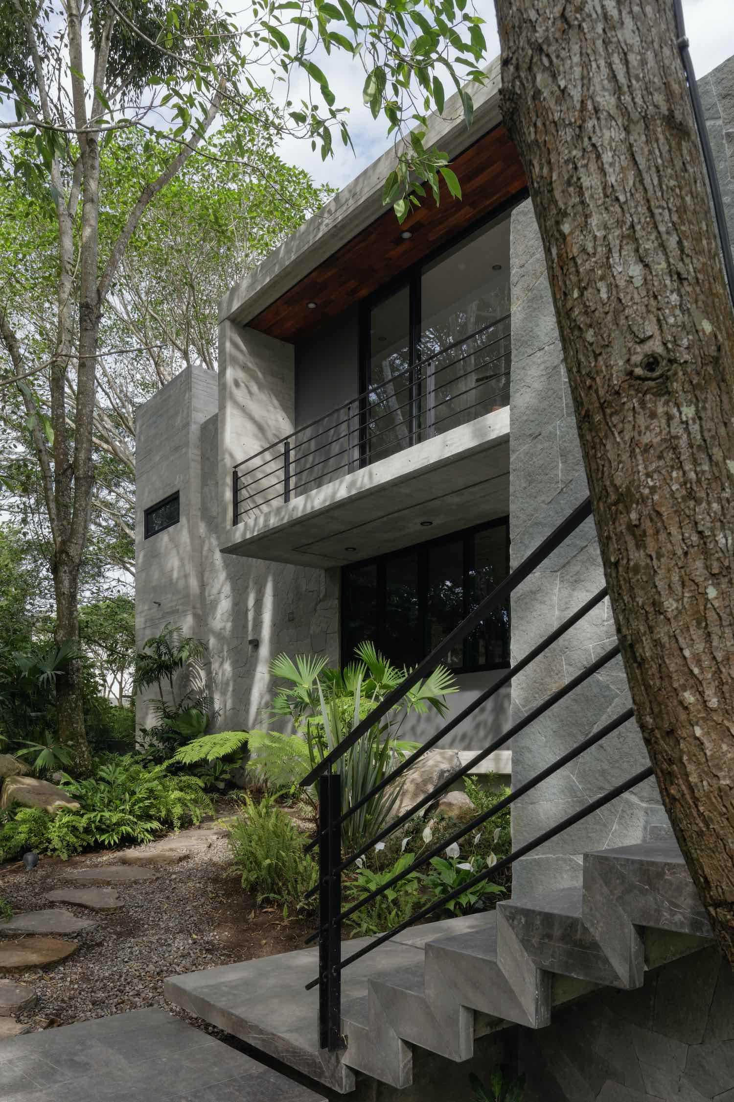 a concrete staircase connecting to the rooftop 