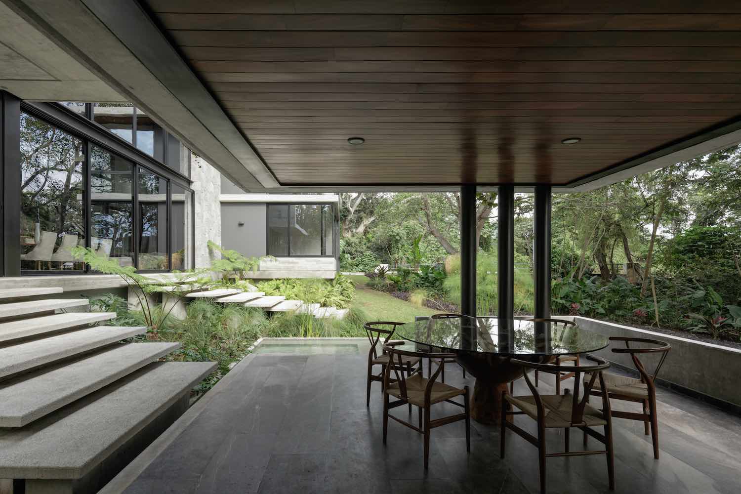 outdoor living space connect to the house with concrete steps 