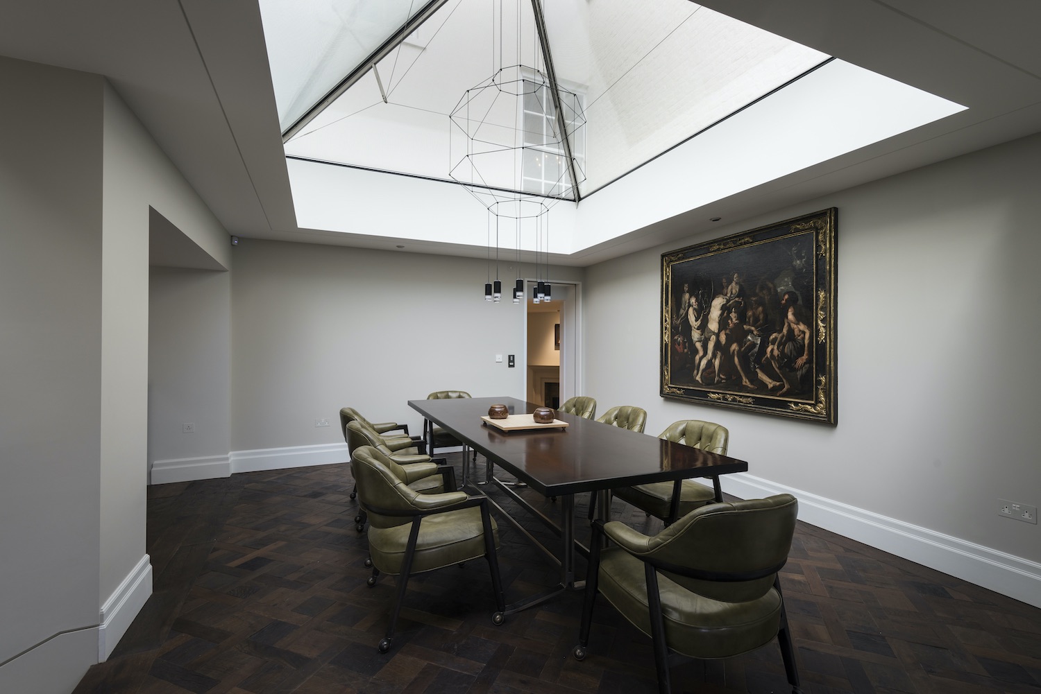dining table with double volume roof above it