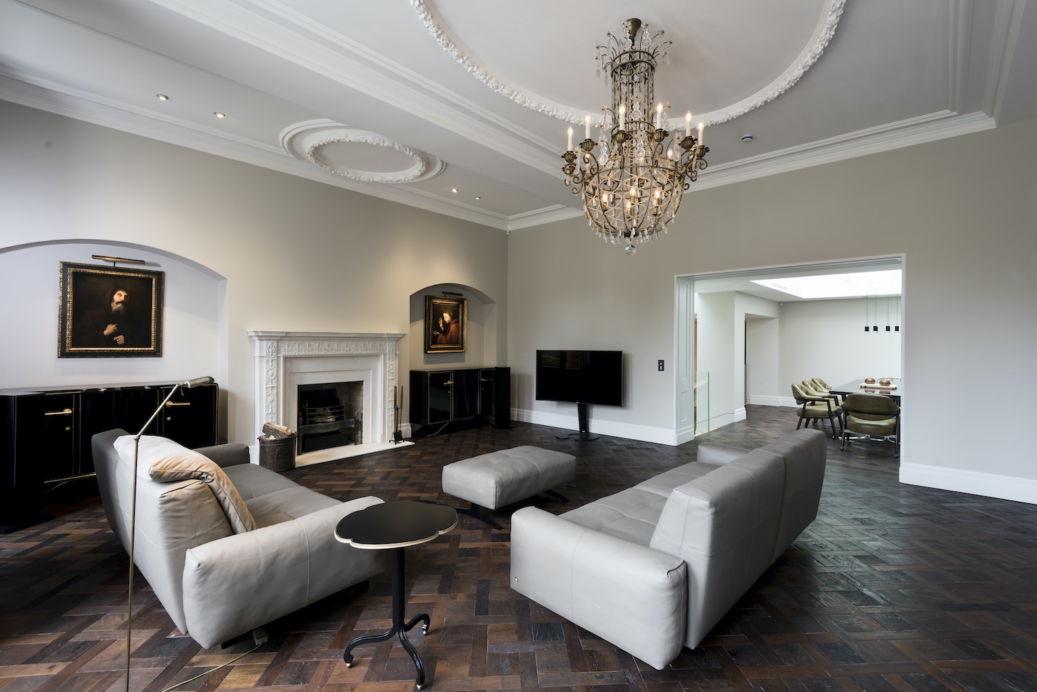 luxury chandelier hanged over the sofa in living room