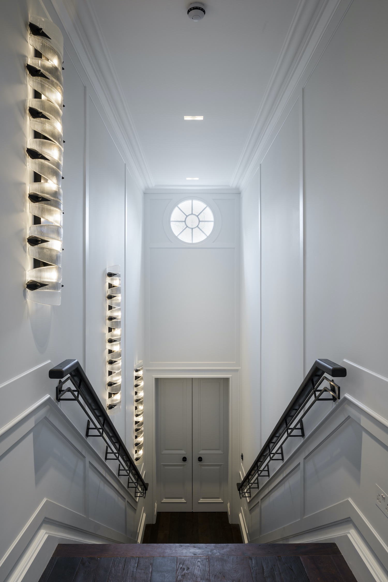 gray door in front of stairs