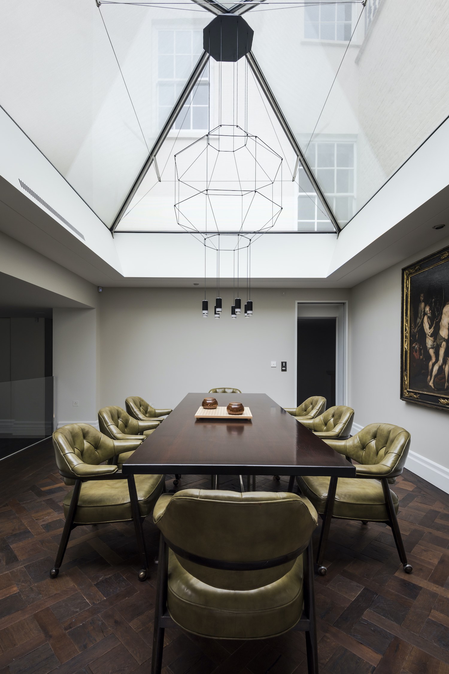 sculptural pendant lamp hanged over dining table