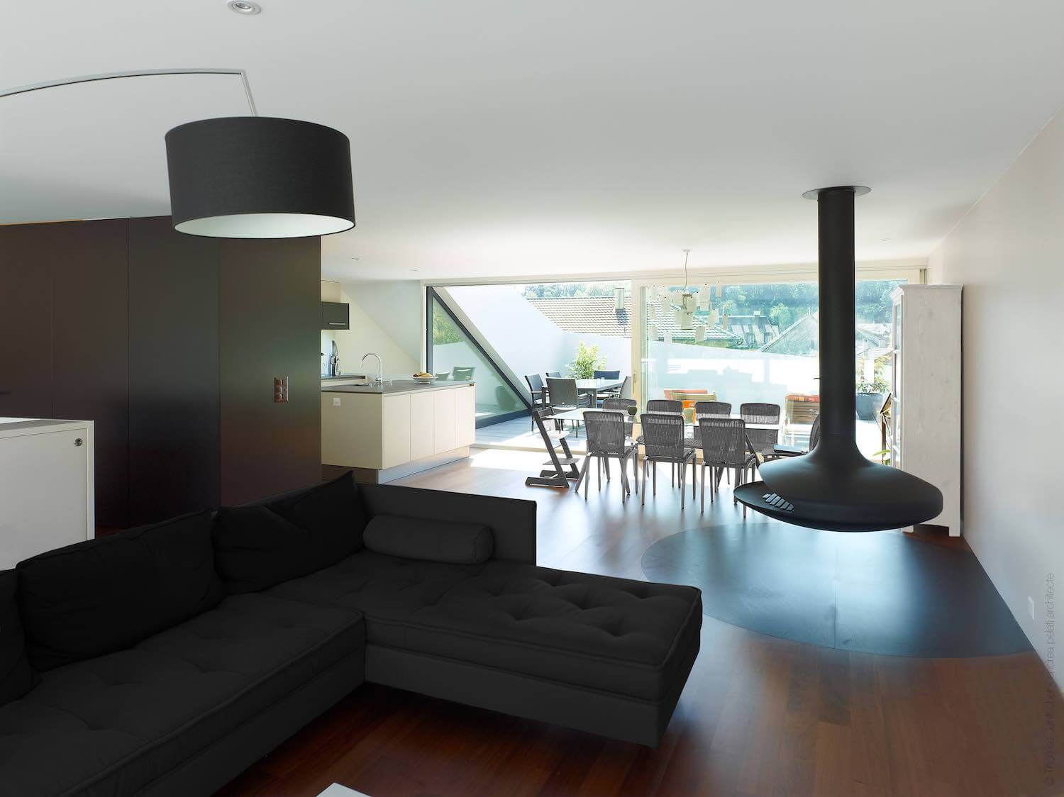 living room with suspended fireplace